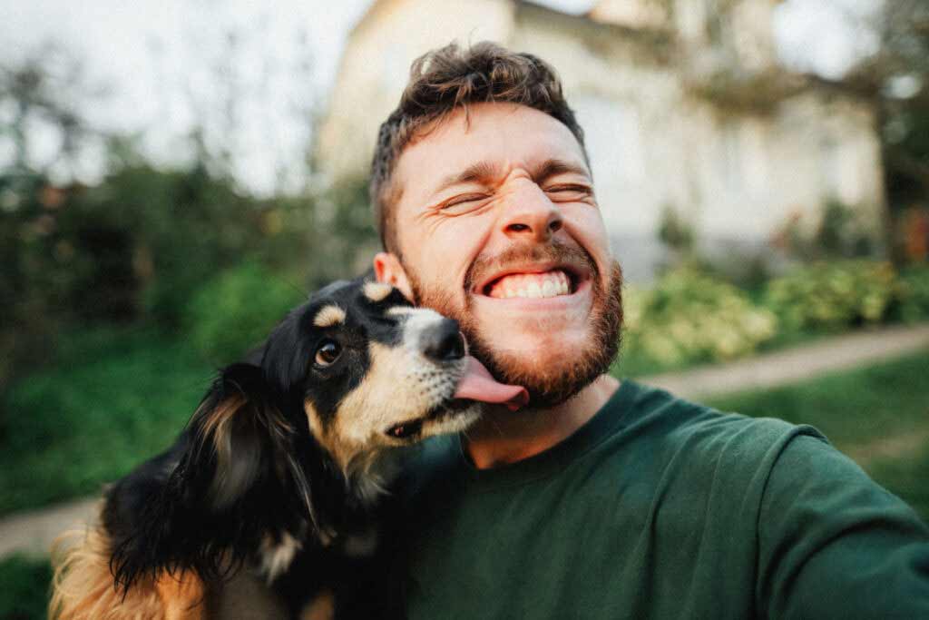 Dog licking owners face