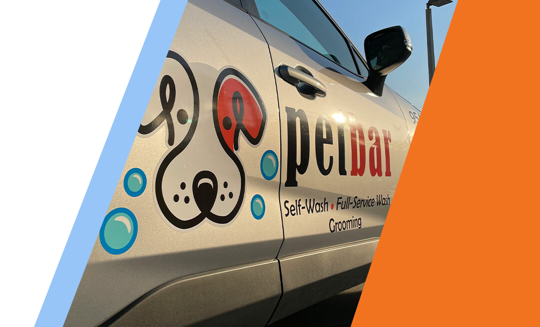 A pet friendly taxi with a prominent PetBar service logo indicating comfortable transportation for pets alongside their owners